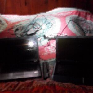 two hp 2000 laptops with power cords and one battery